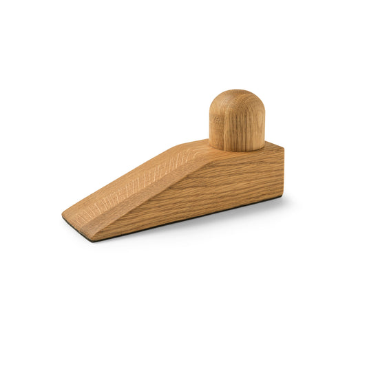 Wooden door stopper on a white background